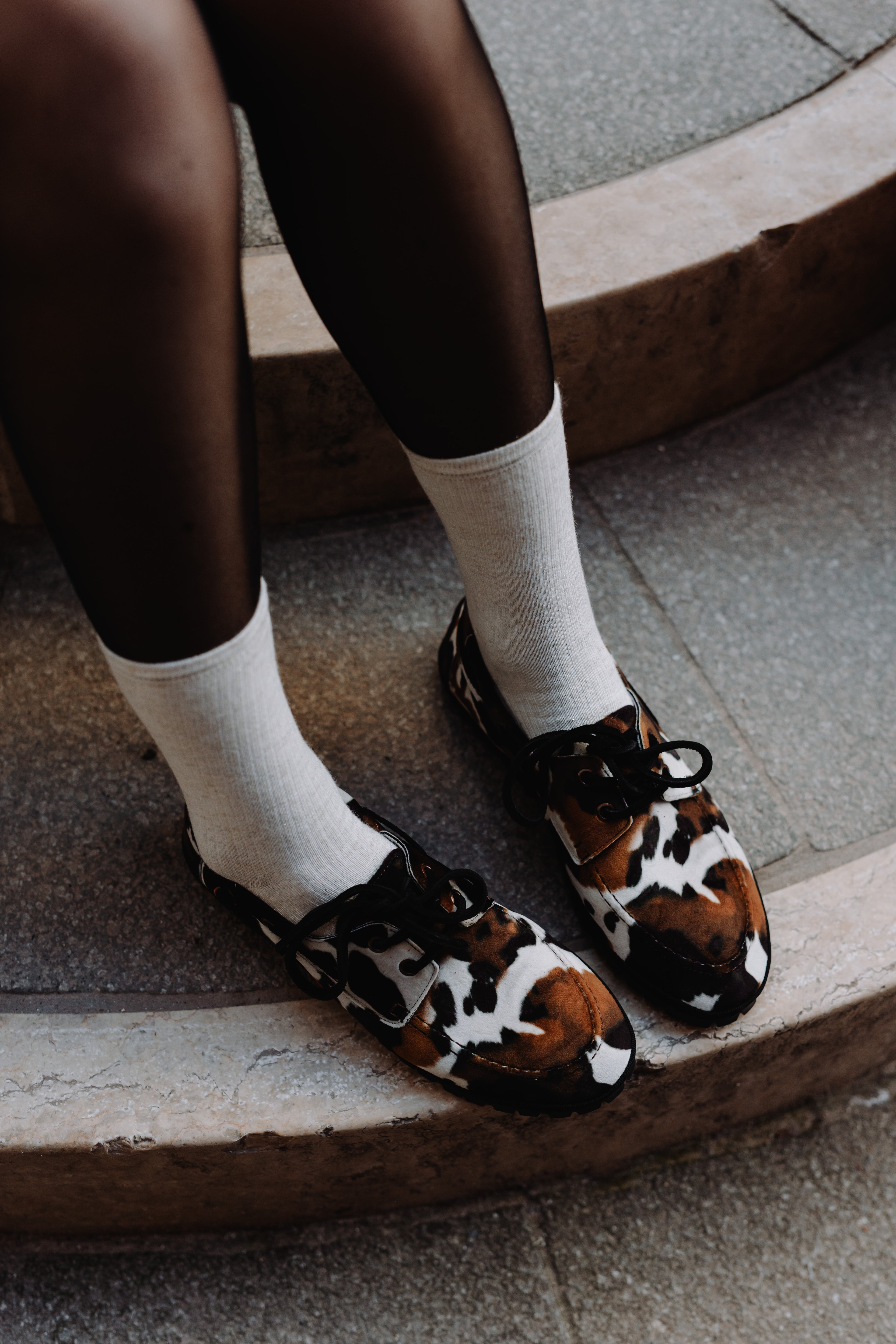 Handcrafted Gondolina Rodeo boat shoes in cow print, featuring authentic Venetian design, lifestyle