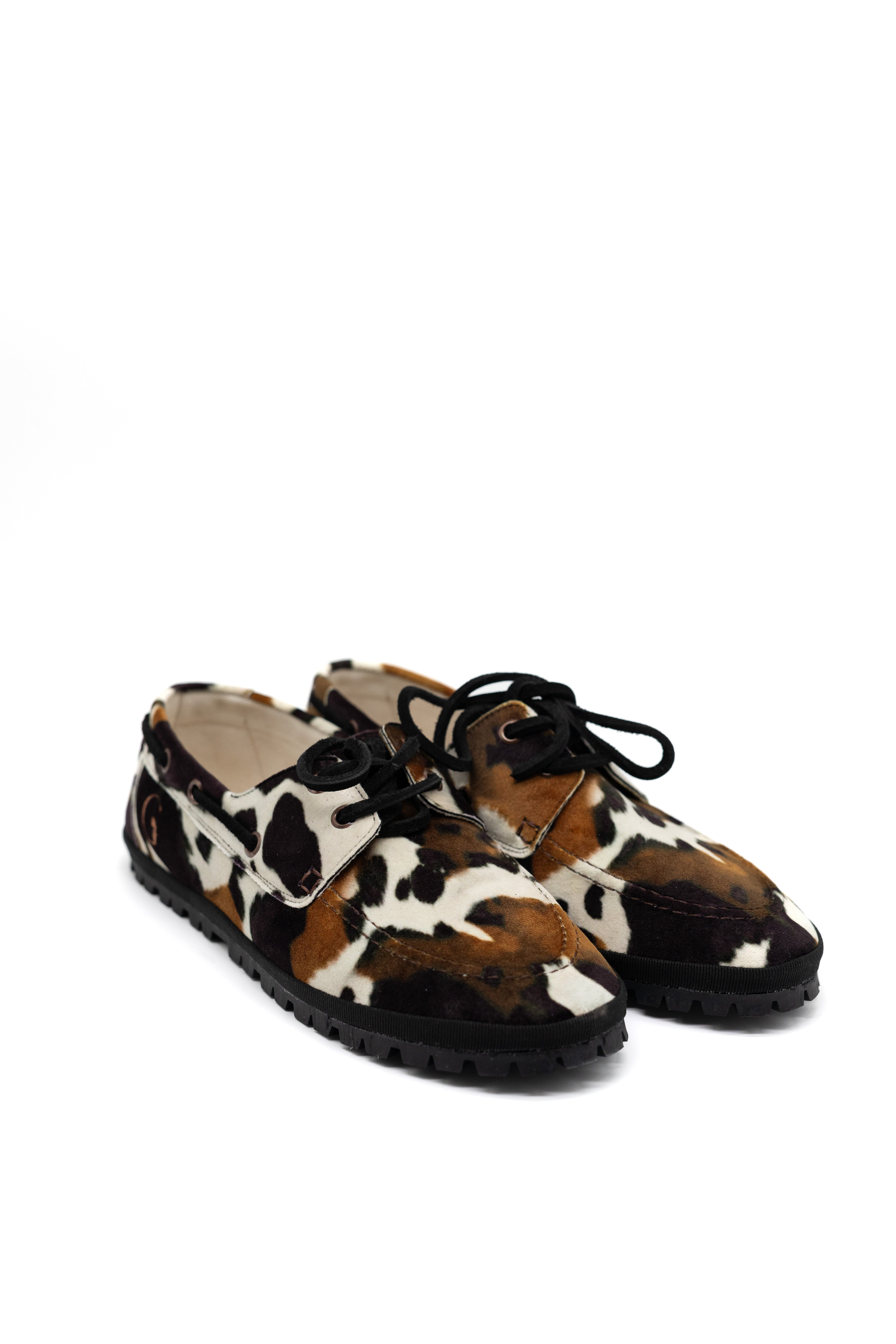 Handcrafted Gondolina Rodeo boat shoes in cow print, featuring authentic Venetian design, close-up