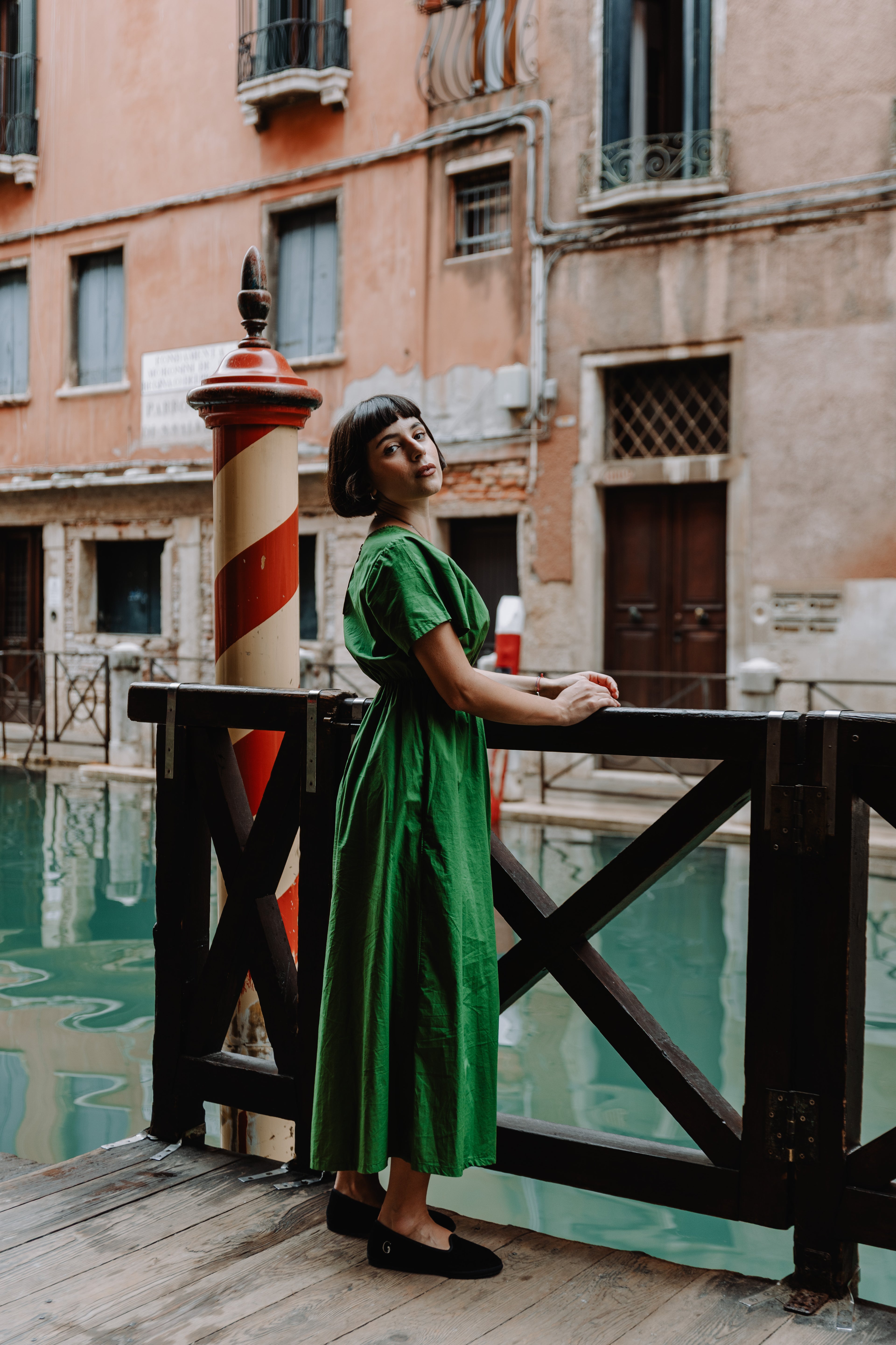 Handcrafted Gondolina Pellestrina flats for women in black velvet, authentic Venetian style, worn by model