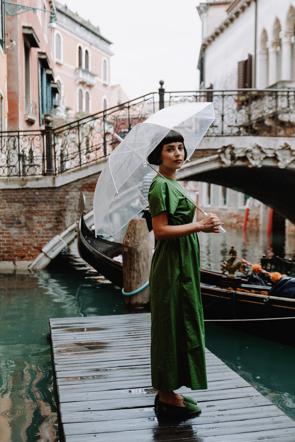 Handcrafted Gondolina Sant Erasmo flats in light green velvet, featuring authentic Venetian design, worn by model