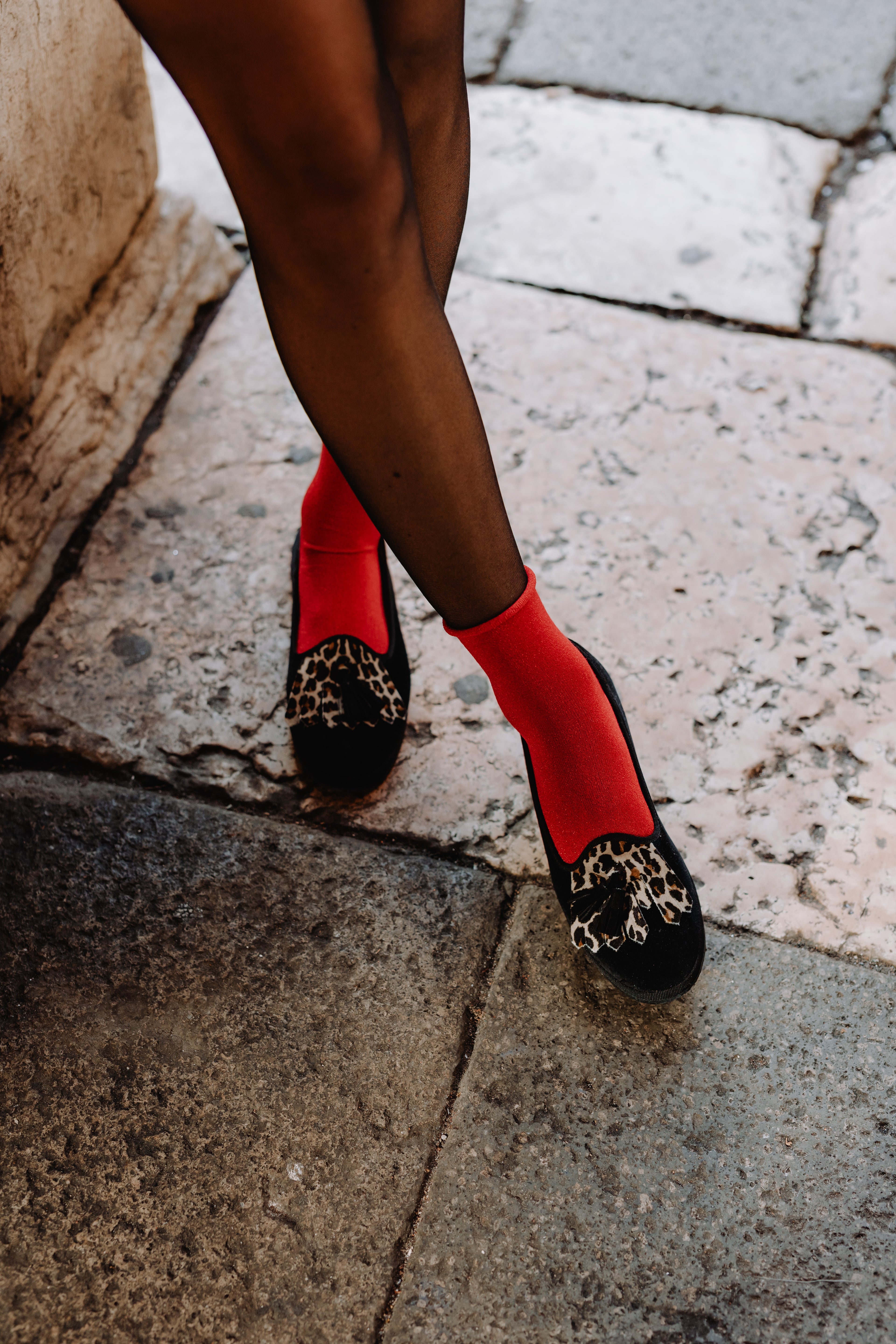 Handcrafted Gondolina Olympia tassel flats in black and leopard fringe in velvet, featuring authentic Venetian design, details