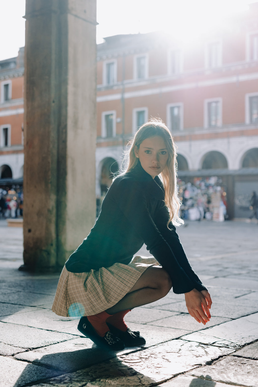 Handcrafted Gondolina Olympia tassel flats in black and leopard fringe in velvet, featuring authentic Venetian design, worn by model