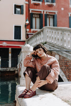 Handcrafted Gondolina Giudecca Mary Jane in burgundy glitter, featuring authentic Venetian design, worn by model