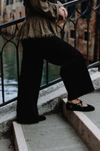 Handcrafted Gondolina Mary Jane in black velvet, Gondola style featuring authentic Venetian design, worn by model