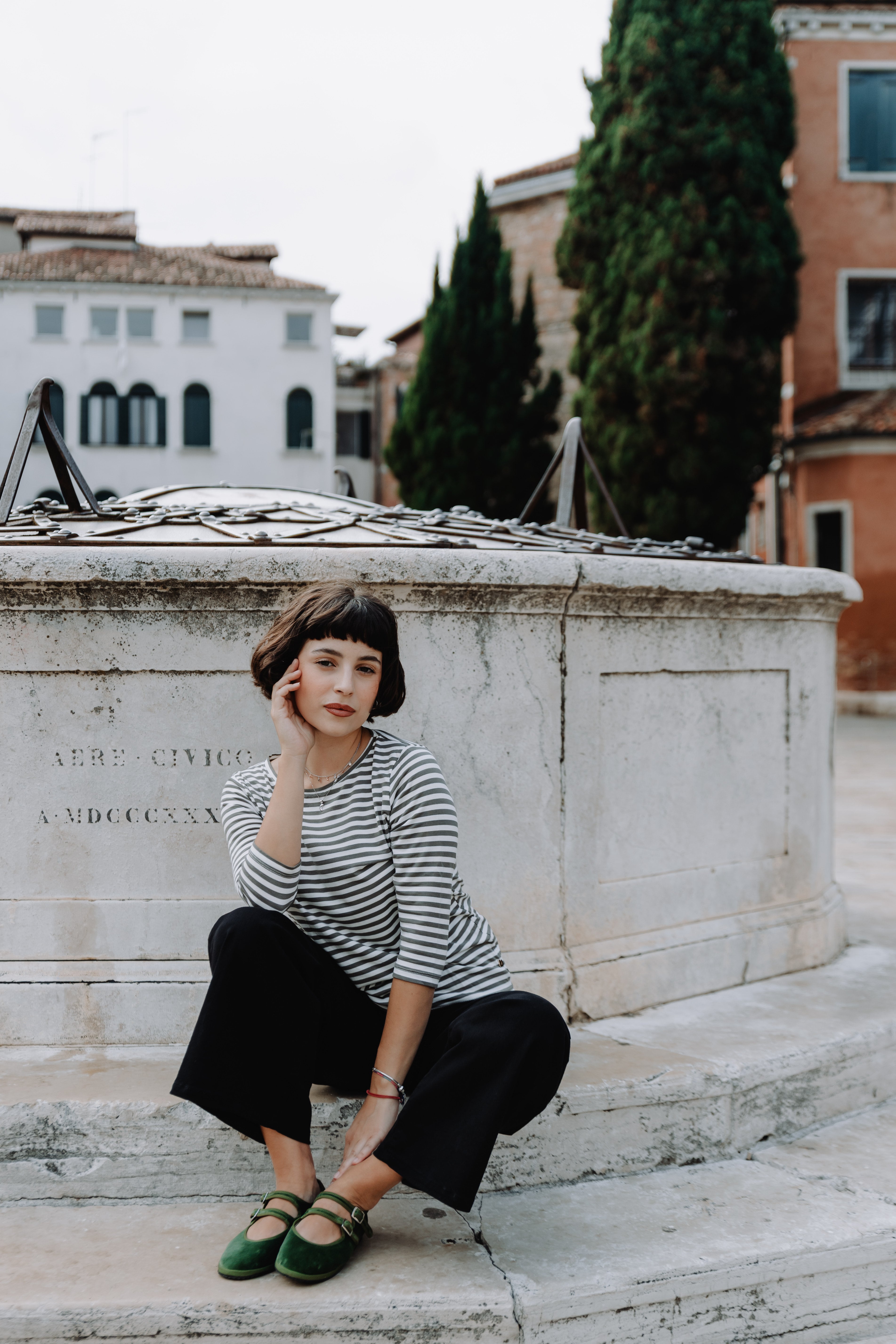 Handcrafted Gondolina Sofia Mary Jane in light green velvet, featuring authentic Venetian design, worn by model