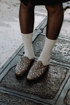 Handcrafted Gondolina Deer Mules with deer print, featuring authentic Venetian design, lifestyle